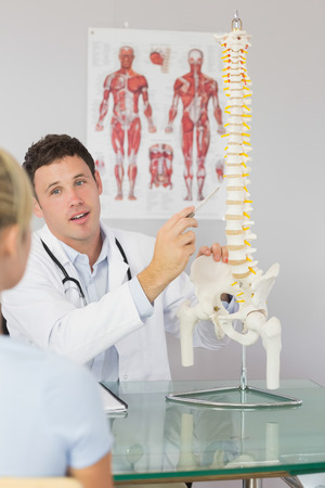 Chiropractor Showing Patient Spine