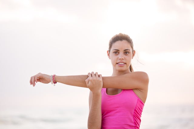 Woman outside stretching