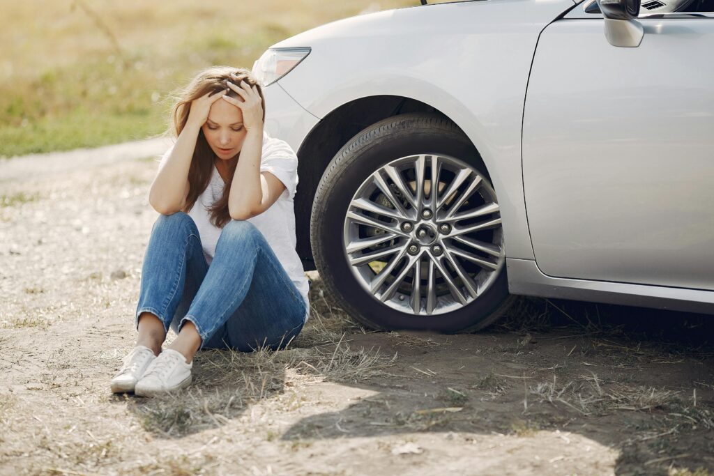 Woman outside of her car after an accident